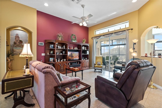 living room with ceiling fan and light tile patterned floors