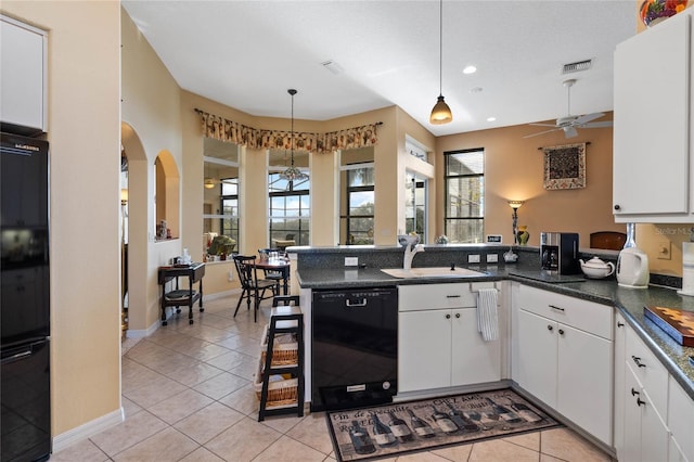 kitchen featuring ceiling fan, sink, decorative light fixtures, white cabinets, and black appliances