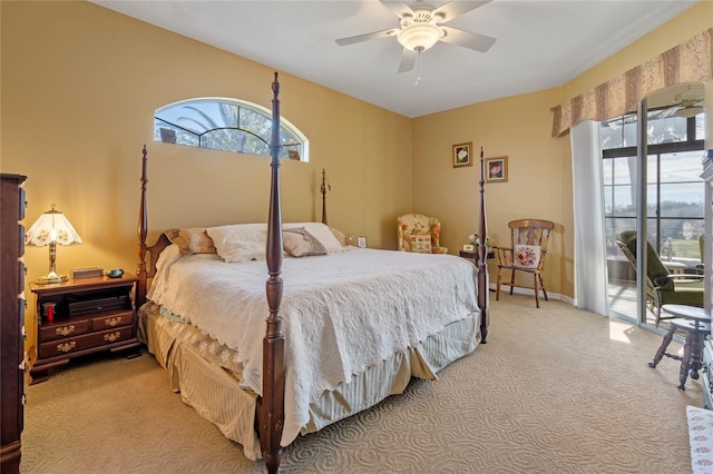 carpeted bedroom with ceiling fan and access to exterior