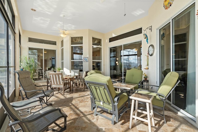 sunroom with ceiling fan