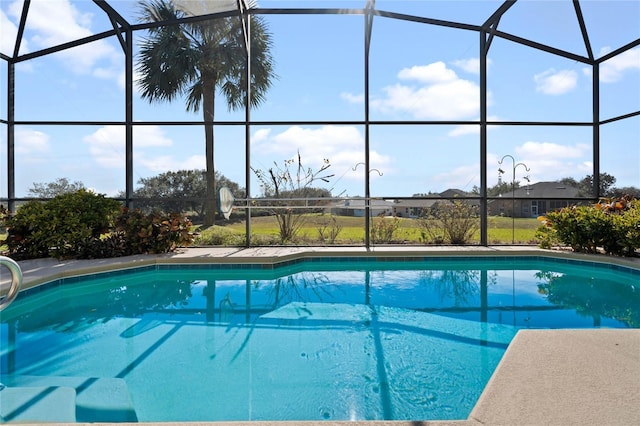 view of swimming pool with glass enclosure