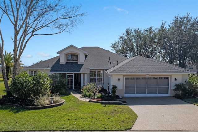 view of front facade featuring a garage and a front yard