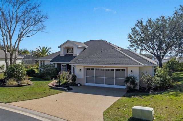 view of front facade featuring a front yard and a garage