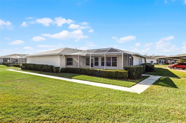 single story home with glass enclosure and a front lawn