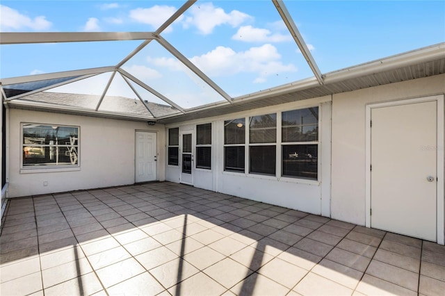 view of patio featuring a lanai