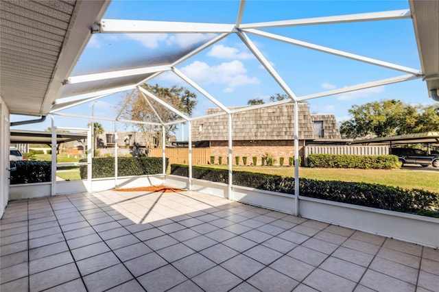 view of patio featuring a lanai