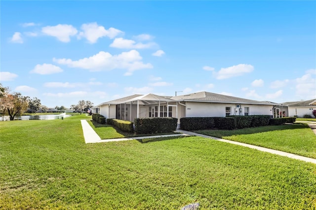 ranch-style home featuring a front yard and a lanai