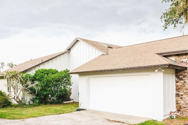 view of side of home featuring a garage