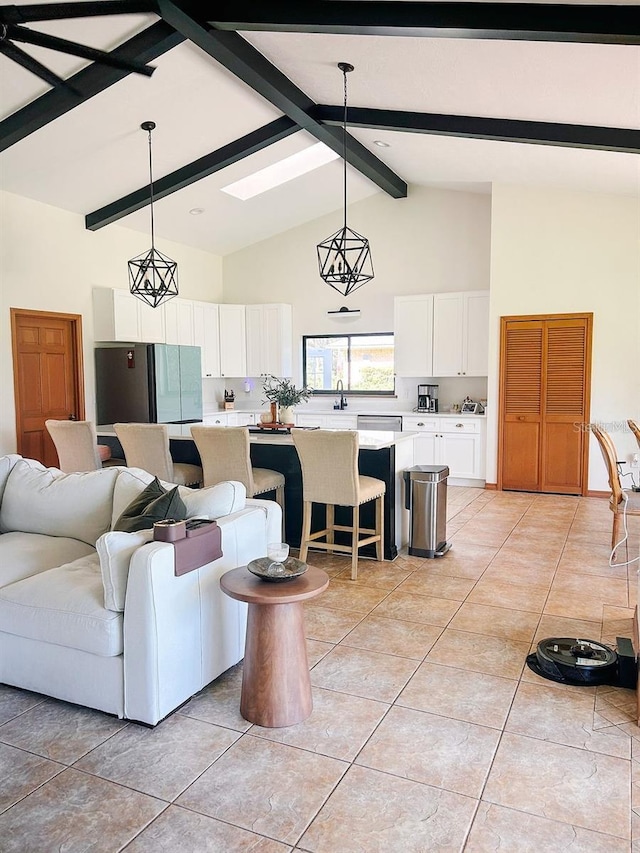 living room with beam ceiling, light tile patterned floors, and high vaulted ceiling