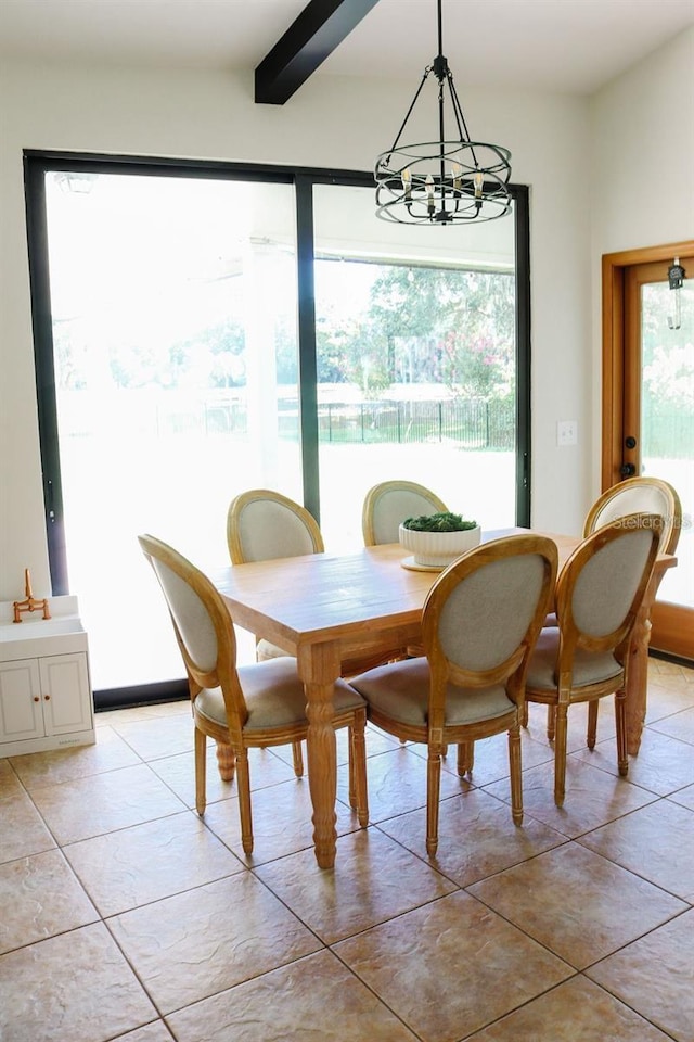 dining room with beam ceiling, light tile patterned floors, plenty of natural light, and a notable chandelier