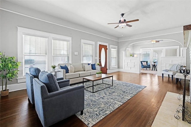 living room with hardwood / wood-style floors, plenty of natural light, and ceiling fan