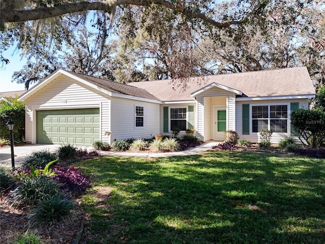 single story home featuring a front yard and a garage