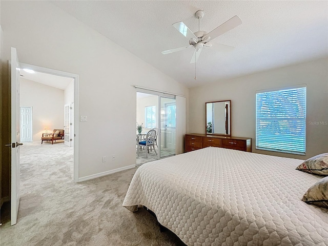 carpeted bedroom with multiple windows, access to outside, ceiling fan, and lofted ceiling