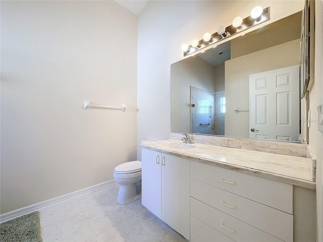 bathroom with vanity, toilet, and a shower with door