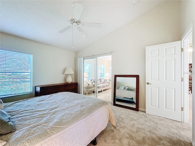 carpeted bedroom with vaulted ceiling and ceiling fan