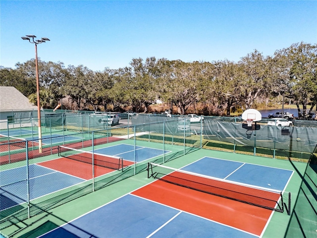 view of tennis court featuring basketball court