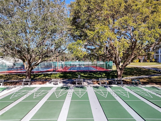 view of property's community with tennis court