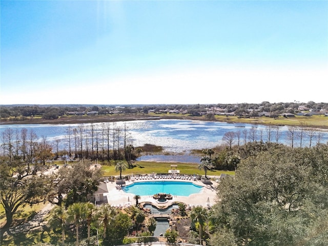 view of swimming pool featuring a water view