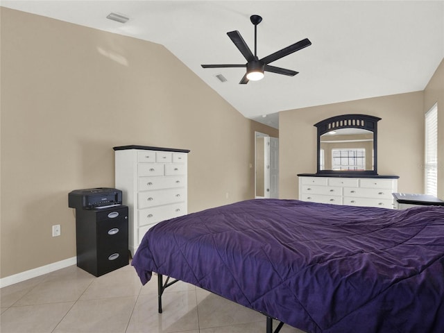 tiled bedroom featuring vaulted ceiling and ceiling fan