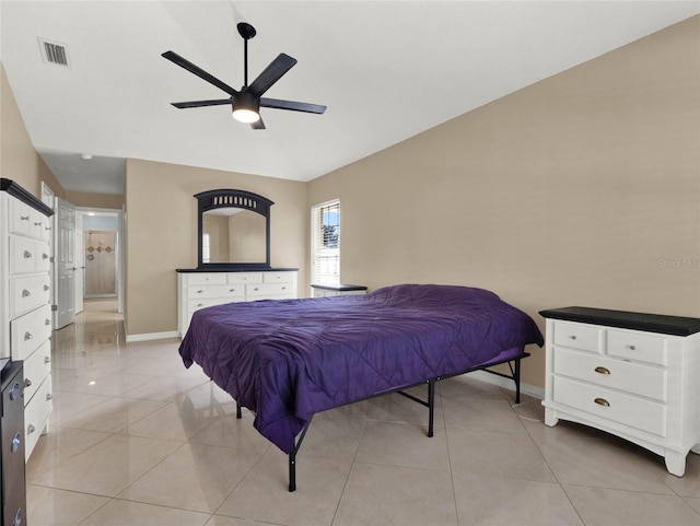 tiled bedroom featuring ceiling fan