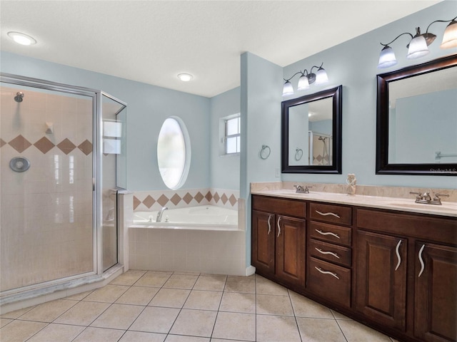 bathroom with shower with separate bathtub, tile patterned floors, and vanity