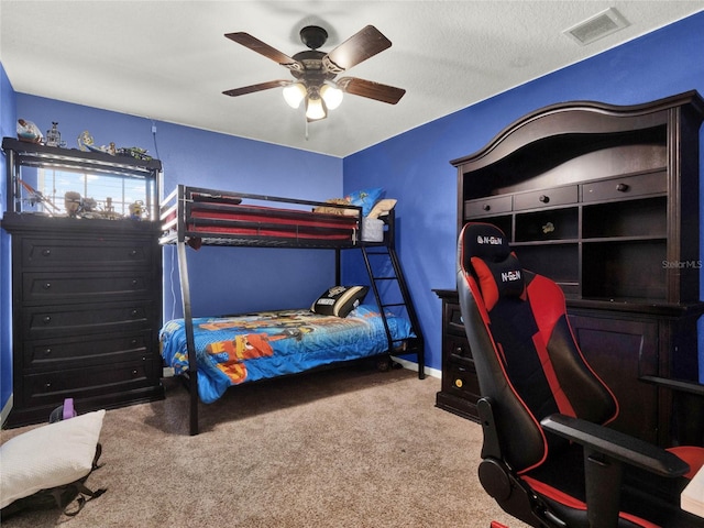 bedroom featuring ceiling fan and carpet flooring