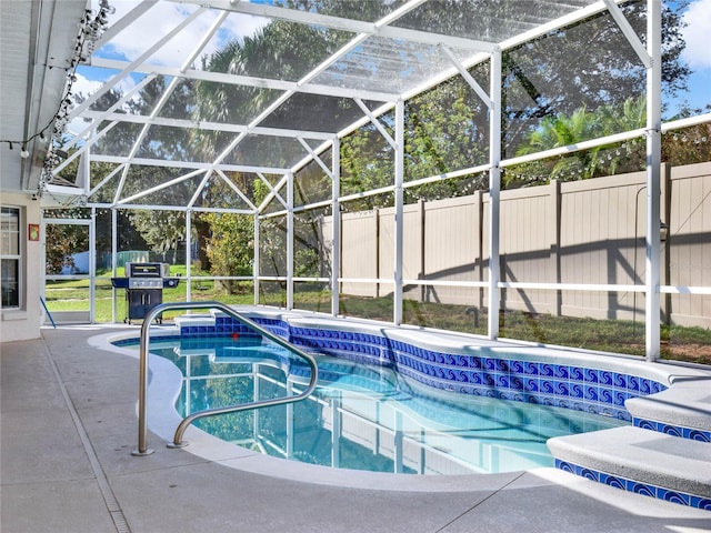 view of swimming pool with grilling area and glass enclosure