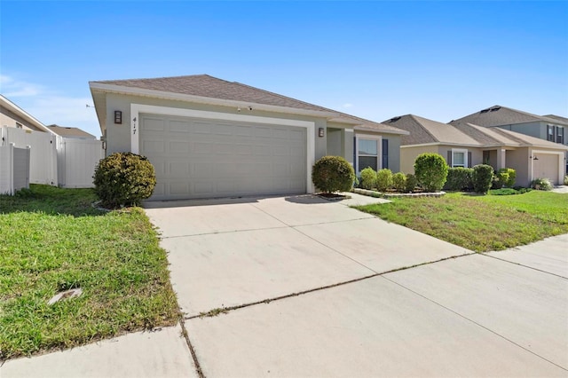 single story home with a garage and a front lawn