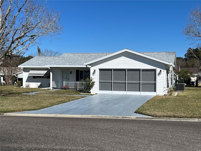 ranch-style house with a front lawn, covered porch, central AC unit, and a garage