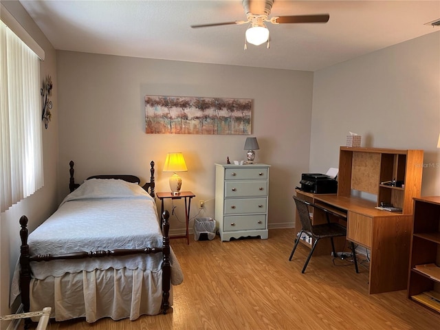 bedroom with light wood-type flooring and ceiling fan