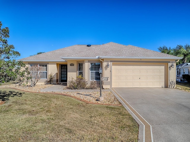 single story home featuring a front lawn and a garage