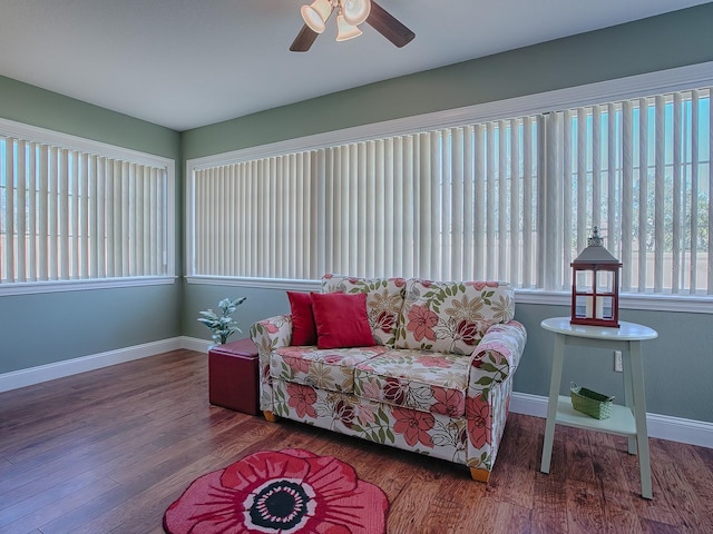 sunroom / solarium featuring ceiling fan