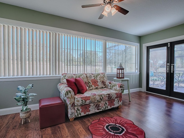 interior space featuring ceiling fan, french doors, and dark wood-type flooring