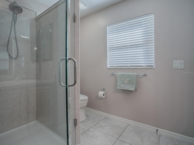 bathroom featuring a shower with shower door, toilet, and tile patterned flooring