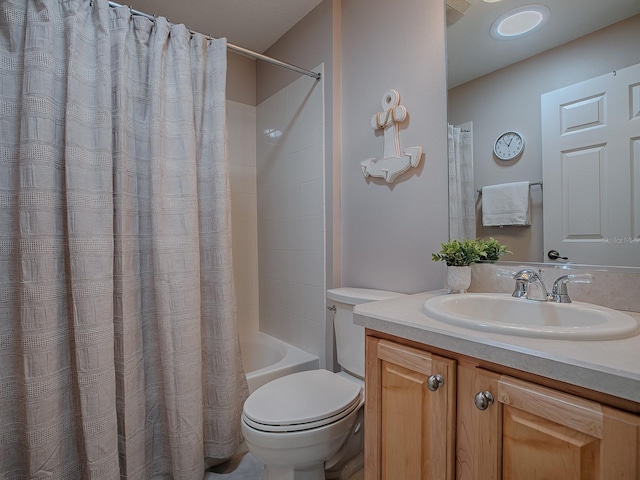 full bathroom featuring toilet, vanity, and shower / bathtub combination with curtain