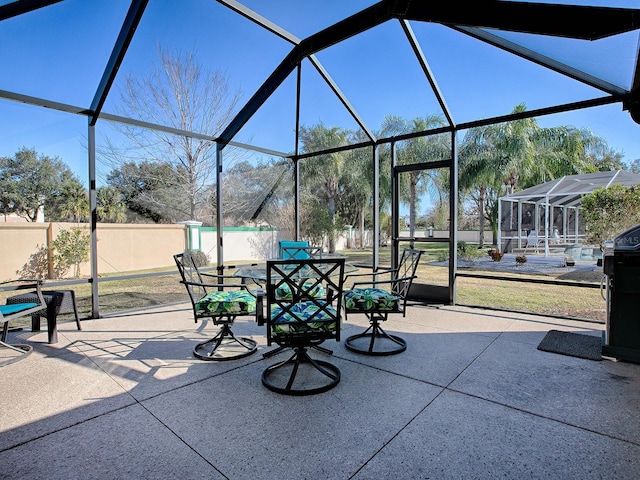 view of patio / terrace with a lanai