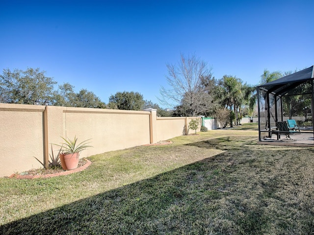 view of yard with a lanai and a patio