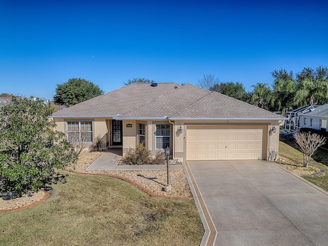 single story home featuring a front yard and a garage