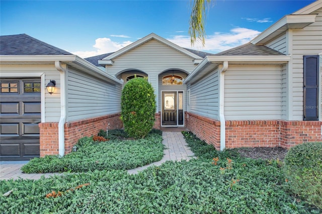 property entrance with a garage