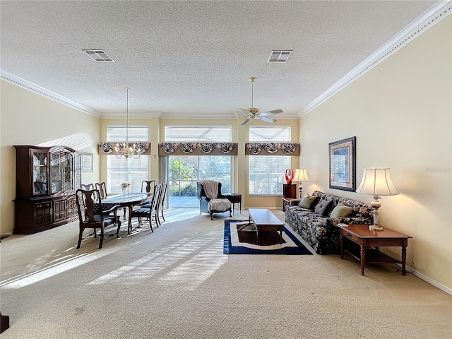 carpeted living room with a textured ceiling, ceiling fan with notable chandelier, and crown molding