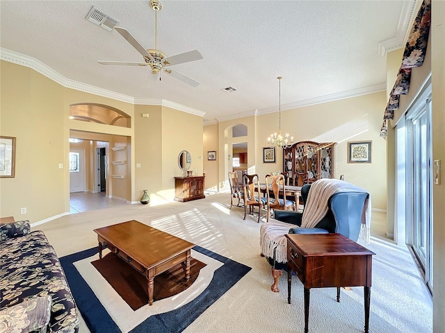 living room featuring ceiling fan with notable chandelier, light colored carpet, and crown molding