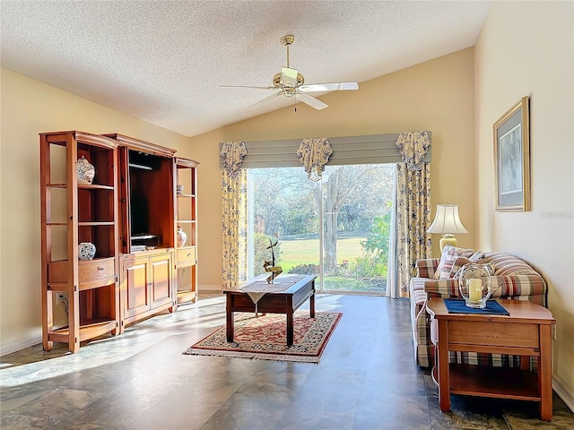 living room with a textured ceiling, ceiling fan, and lofted ceiling