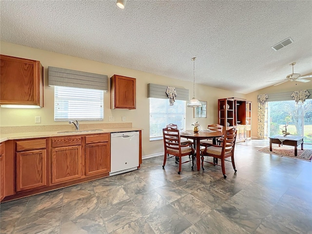 kitchen with pendant lighting, white dishwasher, sink, ceiling fan, and a healthy amount of sunlight