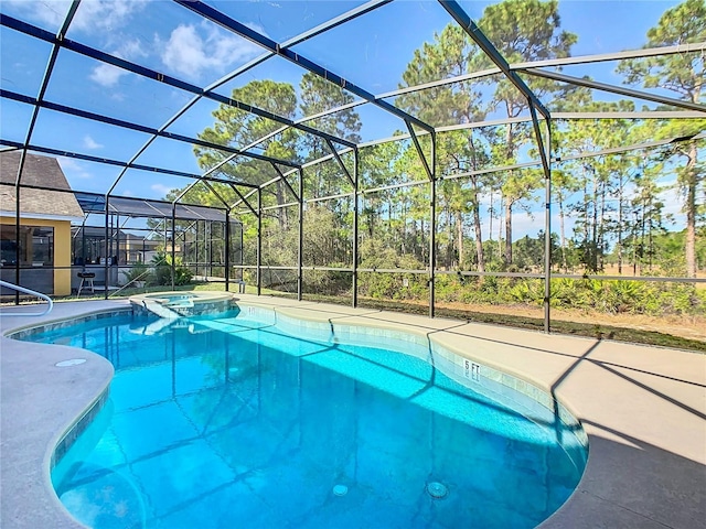 view of pool featuring an in ground hot tub and glass enclosure