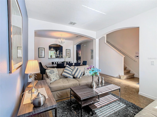 living room with an inviting chandelier