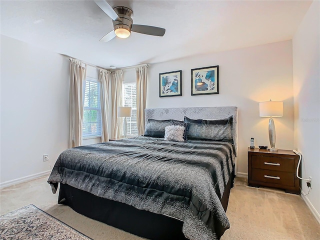 bedroom featuring ceiling fan and light carpet