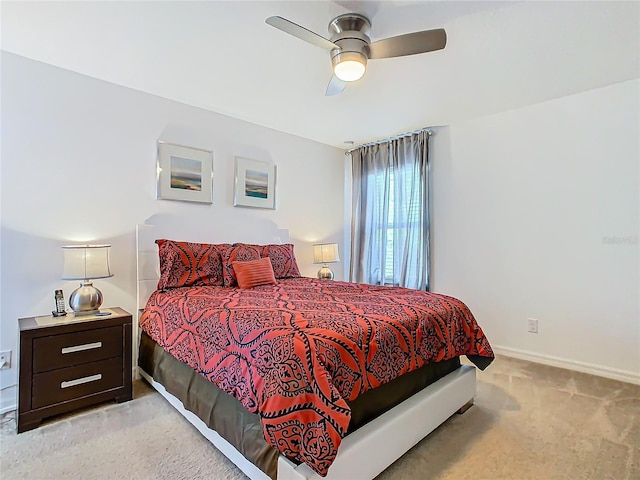 bedroom featuring ceiling fan and light carpet