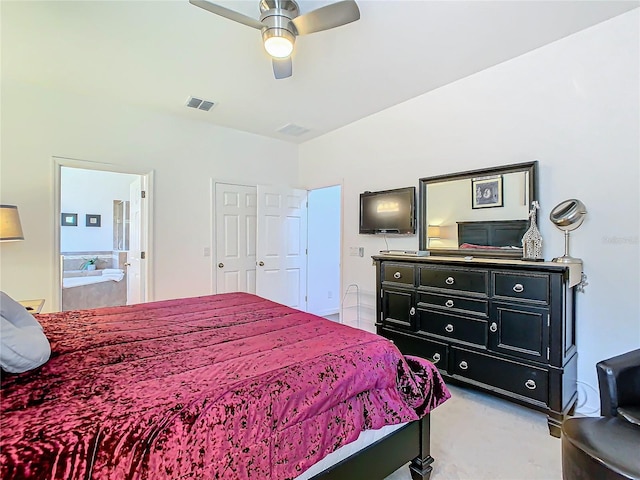 bedroom with ceiling fan and ensuite bath