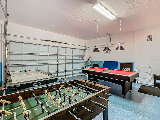 rec room featuring a textured ceiling and pool table