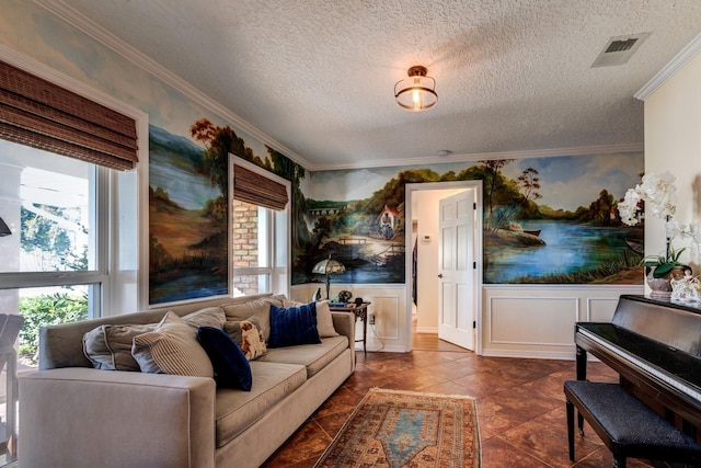 living room with dark tile patterned floors, a textured ceiling, and ornamental molding